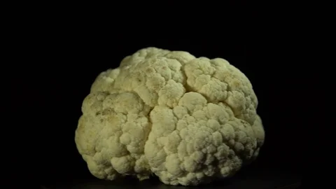 Cauliflower spins on a black background Stock Footage 84035035