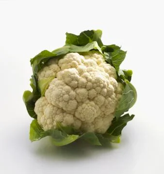A cauliflower on a white surface Stock Photos