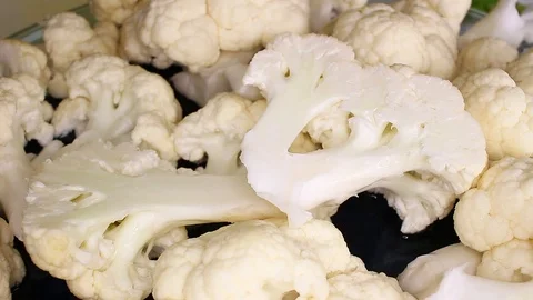 Cauliflower white vegetable slices rotating food video Stock Footage 98167597