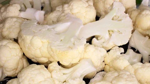 Cauliflower white vegetable slices rotating food video Stock Footage 98167724