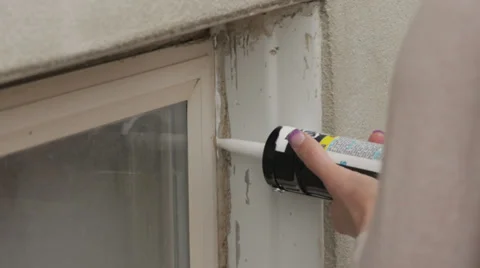 Caulk windows Stock Footage 28655256
