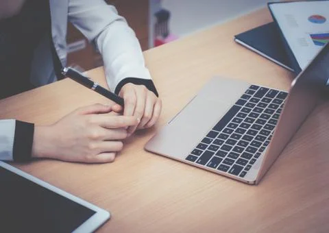 Causal female worker hand using Computer laptop Stock Photos