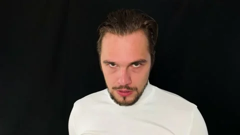 Causasian man intensely staring into camera, fierce and dangerous look at you Stock Footage 192056519