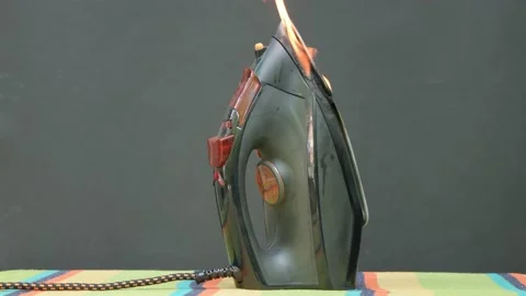 The cause of the fire is overheating of the iron. Ignition of an electric iron i Video stock 201930530