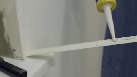 Causes the glue on the skirting Board for ceiling Stock Footage 103284577