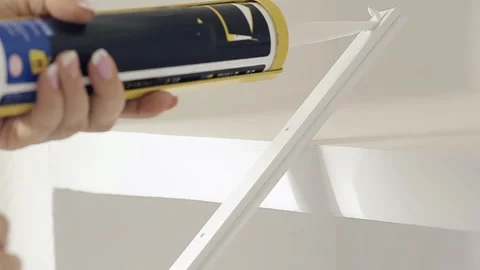 Causes the glue on the skirting Board for ceiling Stock Footage 103287234