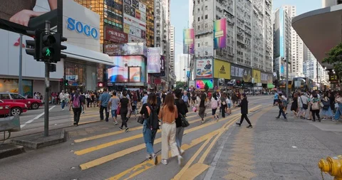 Causeway Bay, Hong Kong , 15 July 2019: Hong Kong city street, people cross t Stock Footage 113686270