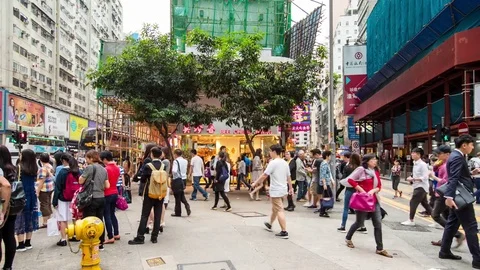 Causeway Bay, Hong Kong, 27 May 2017 -: Pedestrian crossing the road in Hon.. Stock Footage