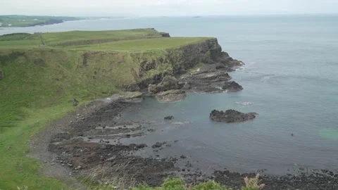 Causeway Coast cliff overlooking the Atlantic sea in Northern Ireland. Dramatic Video stock 311756563