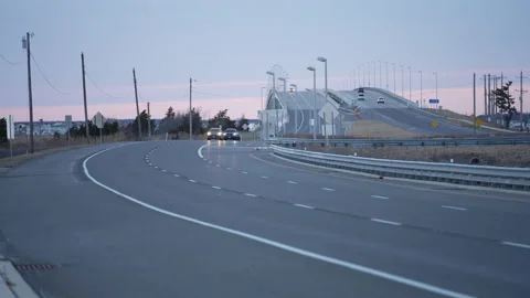 Causeway traffic on a cloudy evening Stock Footage 148354121