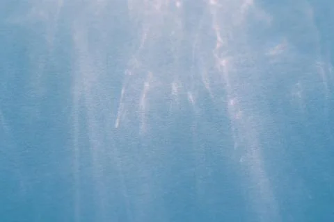 Caustic effect, play of shadows on blue background Stock Photos