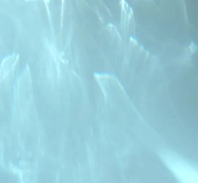 Caustic effect, play of shadows on blue background Foto stock