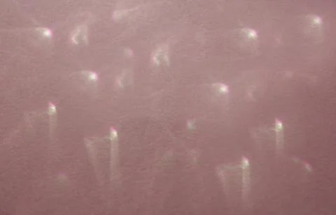 Caustic effect, play of shadows on a peach background Stock Photos