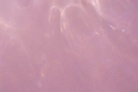 Caustic effect, play of shadows on a pink background Stock Photos