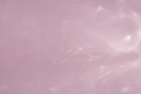 Caustic effect, play of shadows on a pink background Stock Photos