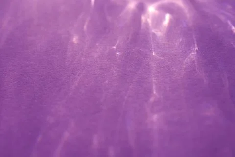 Caustic effect, play of shadows on a purple background Stock Photos