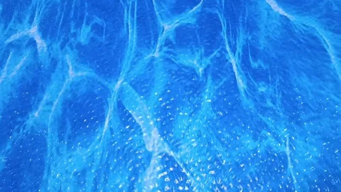 Caustic light patterns on a blue swimming pool. Suitable for summerthemed design Видео 335058195
