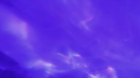 Caustic prism shimmer dances across violet textured surface creating ethereal Stock Footage 336285801