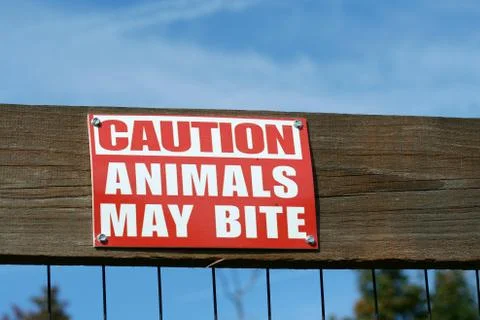 Caution animals may bite sign Stock Photos
