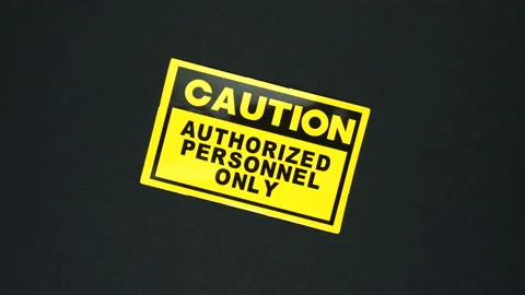 CAUTION AUTHORIZED PERSONNEL ONLY warning sign word text Video stock 126670543