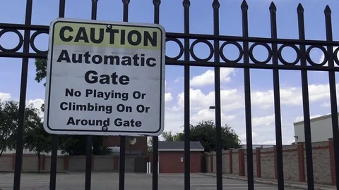 Caution Automatic Gate Sign on fence Video stock 76475466
