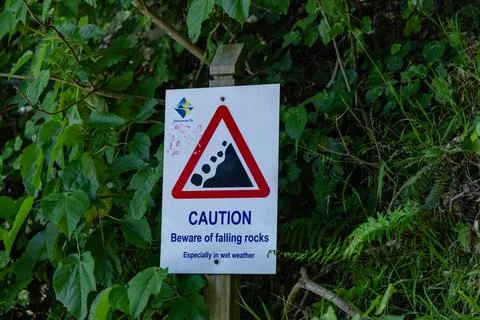 Caution Beware Falling Rocks Especially Wet Weather Stock Photos