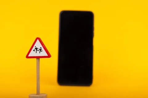 Caution Children with Smartphone in Background Stock Photos
