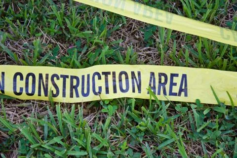 Caution Construction Area yellow perimeter tape Foto stock