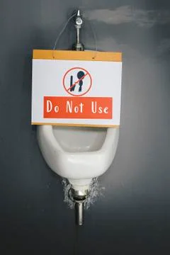 Caution Defective Do Not Use unclean restrooms than an unflushed urinal Stock Photos