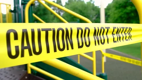 Caution do not enter written on tape to restrict access to public parks Video stock 130482640