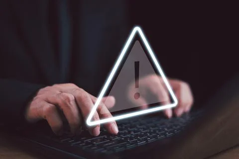 Caution failure system hacked warn alert concept. Businessman use computer la Stock Photos