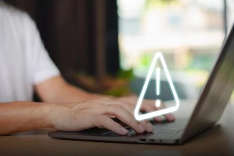 Caution failure system hacked warn alert concept. Businessman use computer la Stock Photos