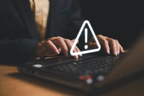 Caution failure system hacked warn alert concept. Businessman use computer la Stock Photos