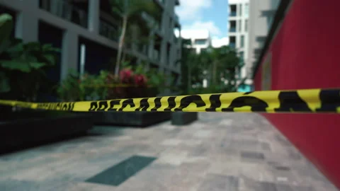 Caution line do not cross tape protect crime scene movement with wind. Stock Footage 170978381