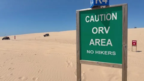 Caution ORV Area sign on Silver Lake Sand Dunes. Stock Footage 345517860