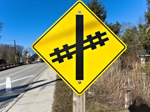 Caution railroad intersection ahead Stock Photos