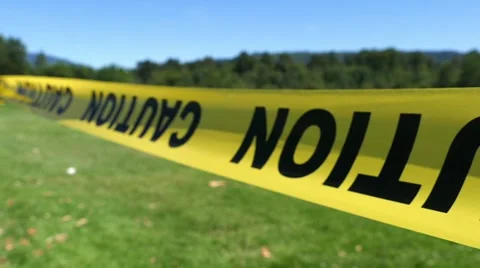 Caution Ribbon - Closed Field - Close up - Loop Stock Footage 52052961