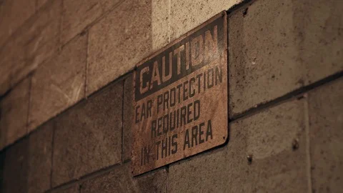 CAUTION SIGN ON THE FACTORY WALL Stock Footage 108045493