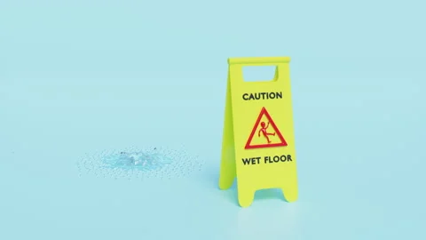 Caution slippery or wet floor caution plastic sign with wet area isolated o.. Stock Footage 229702071