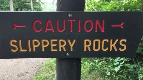 Caution Slippery Rocks Sign 스톡 동영상 79111761