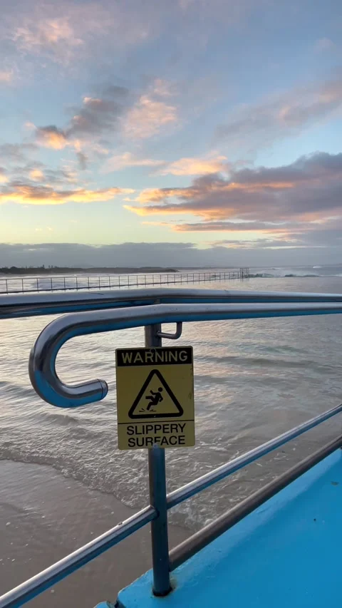 Caution Slippery Surface Warning Sign Forster Ocean Baths 스톡 동영상 338382771