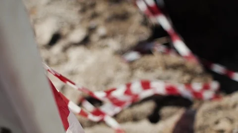Caution tape at an accident scene or Road Warning Stock Footage 124024469