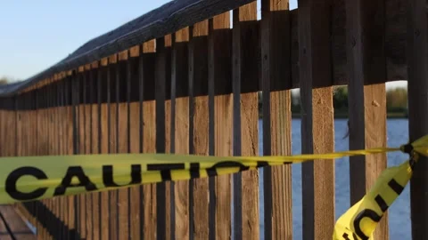 Caution tape blocking the fishing dock Stock Footage 245593880