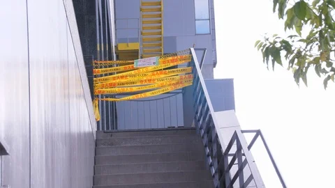 Caution Tape Blocks off Staircase During Typhoon Jebi Cleanup Medium Video stock 100576394