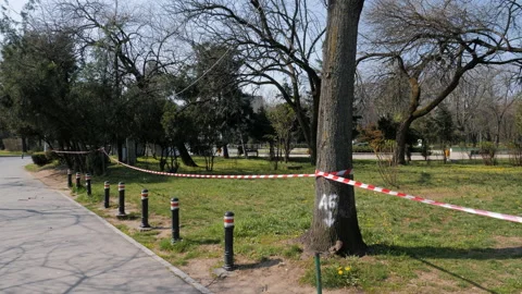 Caution Tape at Closed Park due to Coronavirus outbreak, Quarantined City. Stock Footage 132278297