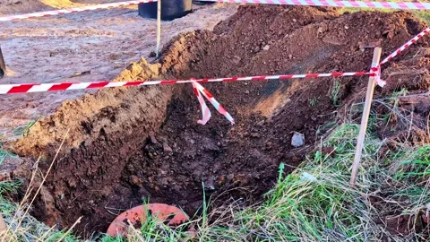Caution tape marking deep excavation work at construction site Stock Footage 341741787