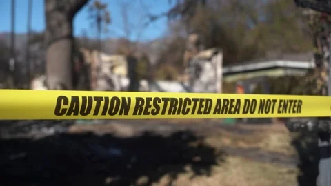 Caution tape is placed around a restricted area following an incident to ensure Stock Footage 301356453