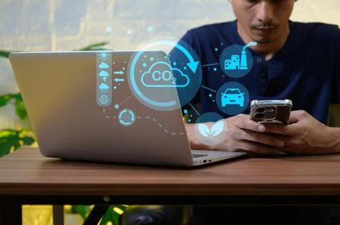 Caution Technology Impact on Environment with Man Using Laptop and Phone Stock Photos