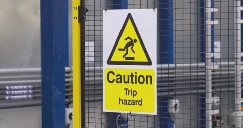 Caution Trip Hazard warning sign work employee health and safety Video stock 199886891