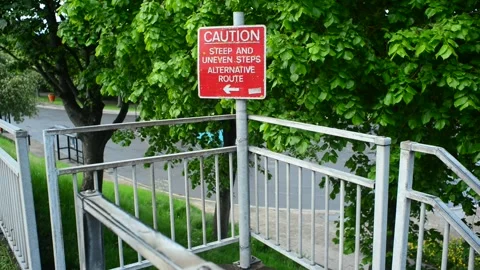 Caution warning sign of steep and uneven steps selby united kingdom Stock Footage 171321315